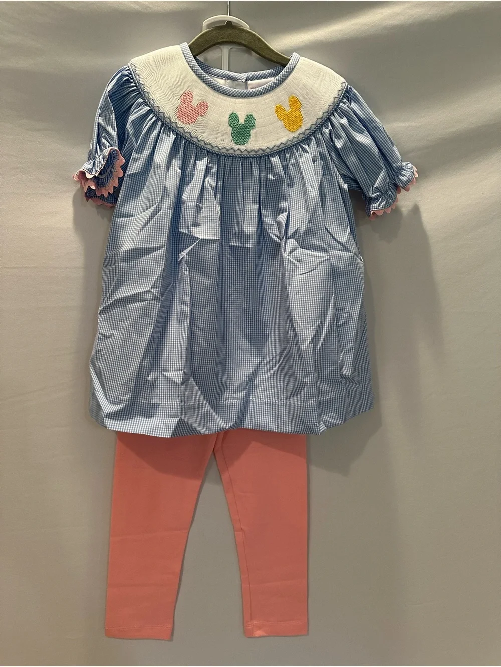Blue Gingham Smocked Top with Pink Leggings with Matching Bow.